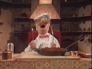 GIF of Muppet Swedish Chef dancing in a kitchen with utensils 